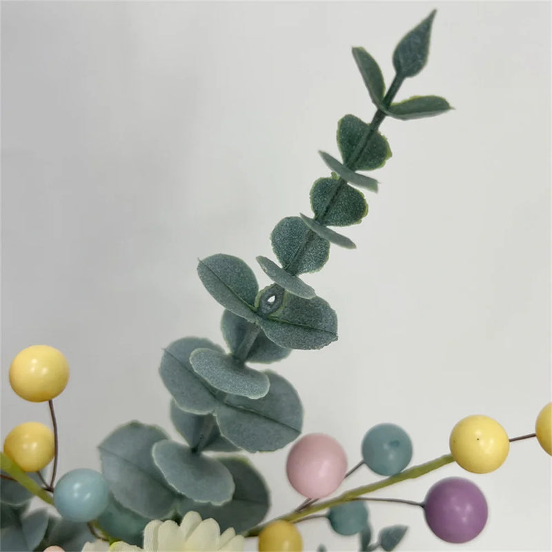 décoration de pâques œufs artificiels et bouquets de fleurs colorées