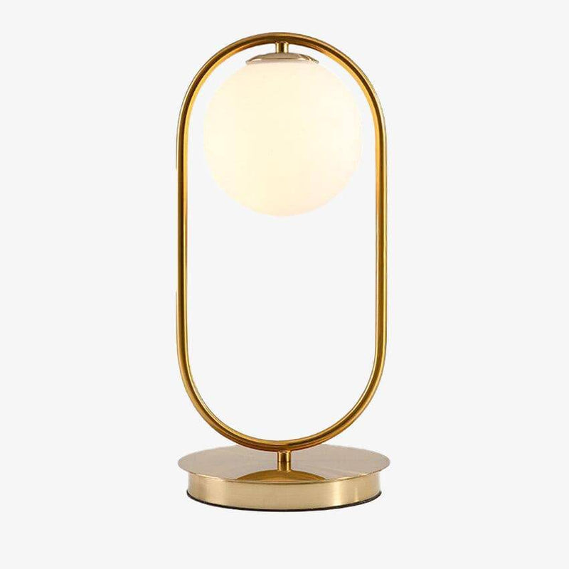 Design bedside lamp in gilded metal and glass ball