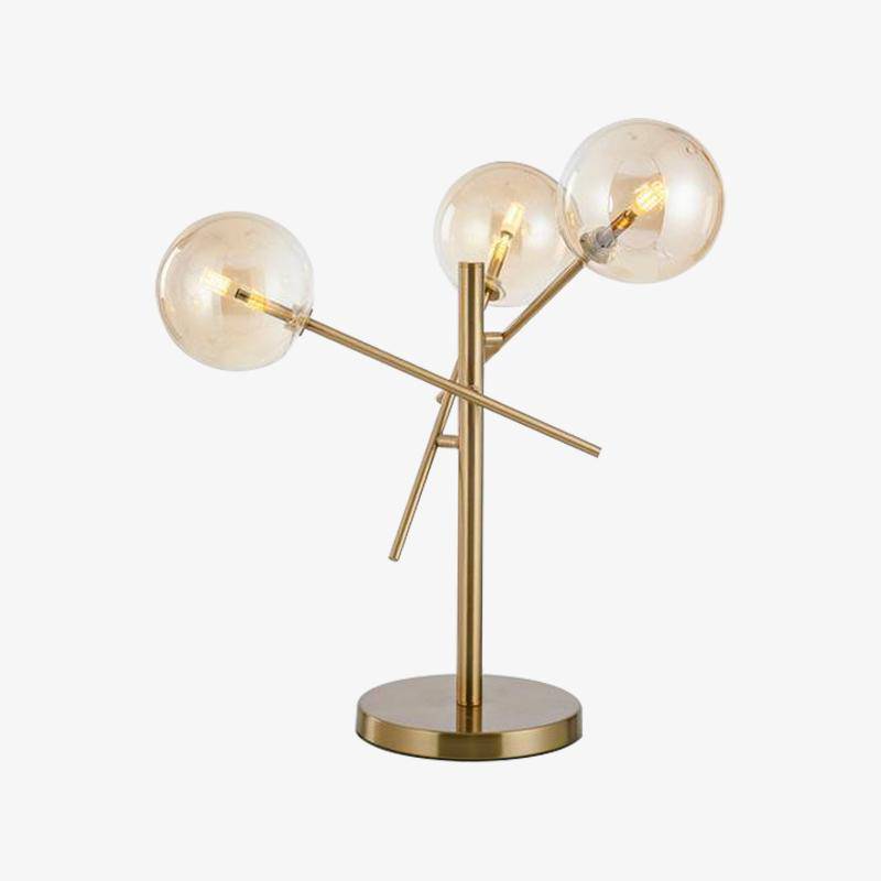 Design table lamp in gold with glass balls