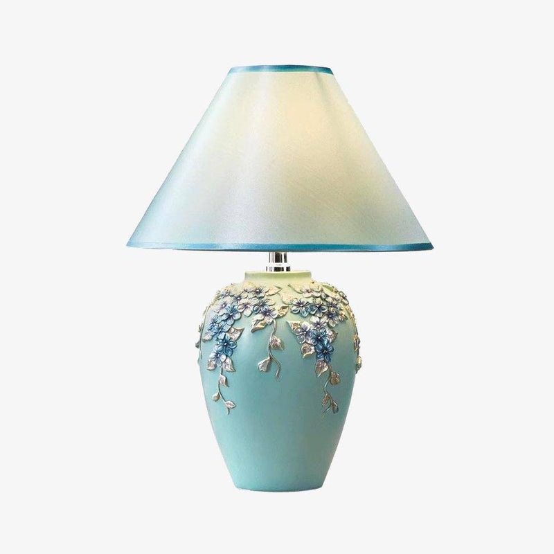 Lámpara de mesa con pantalla y base de flores de colores