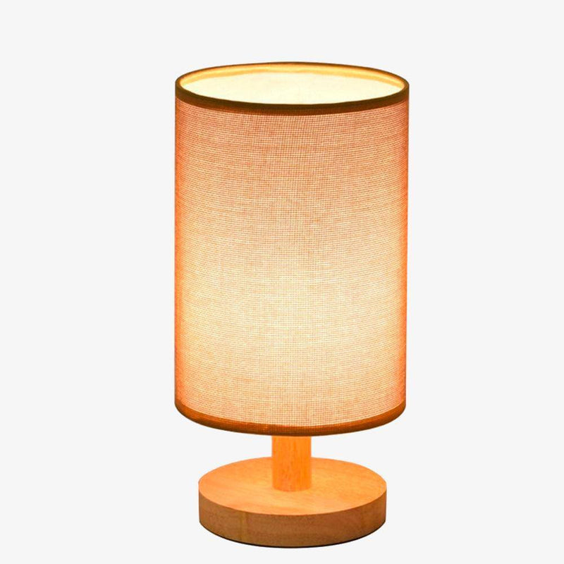 Bedside lamp with lampshade in cylindrical fabric