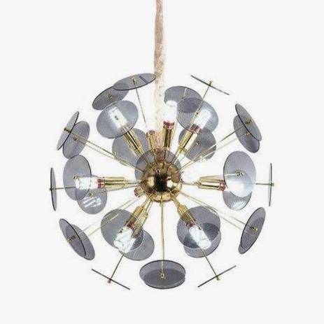 Luxury gold design chandelier and flat round smoked plates