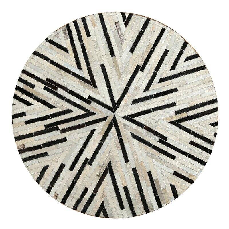 Modern round carpet with black and white geometric shapes Skin