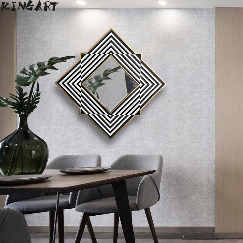 Wall mirror with diamond shape and black and white stripes in Frame wood