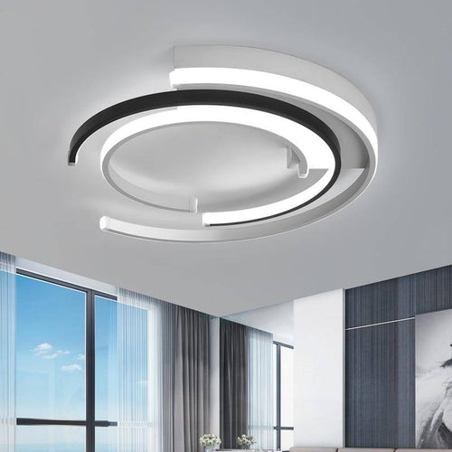 Modern LED ceiling light in the shape of an arc of circles