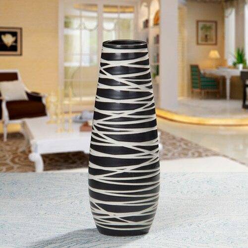 Design vase in black ceramic with zebra pattern
