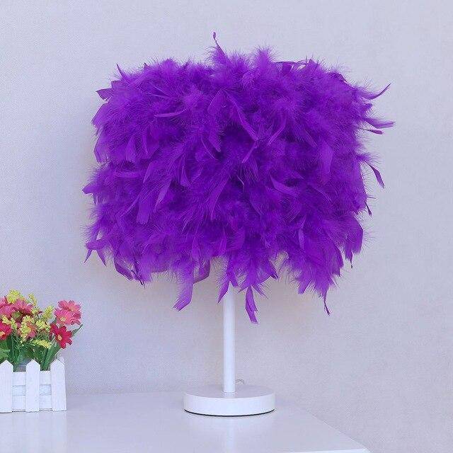 LED table lamp with coloured feathers