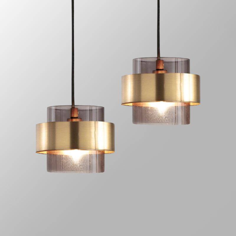 pendant light with gold cylindrical LED design and glass