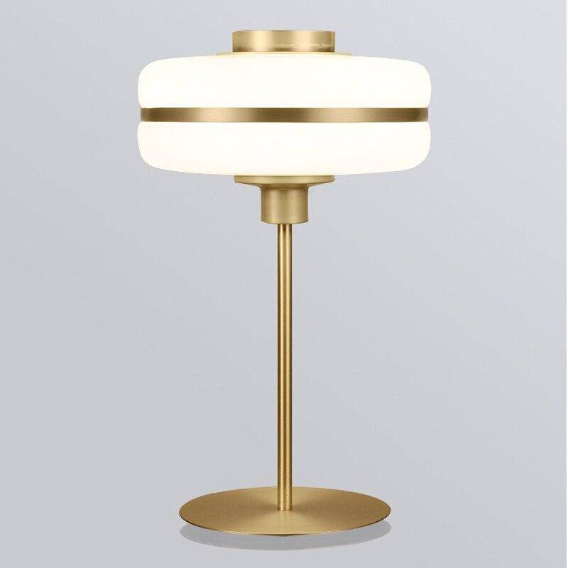 Modern LED bedside lamp with rounded shape and gold base Hotel