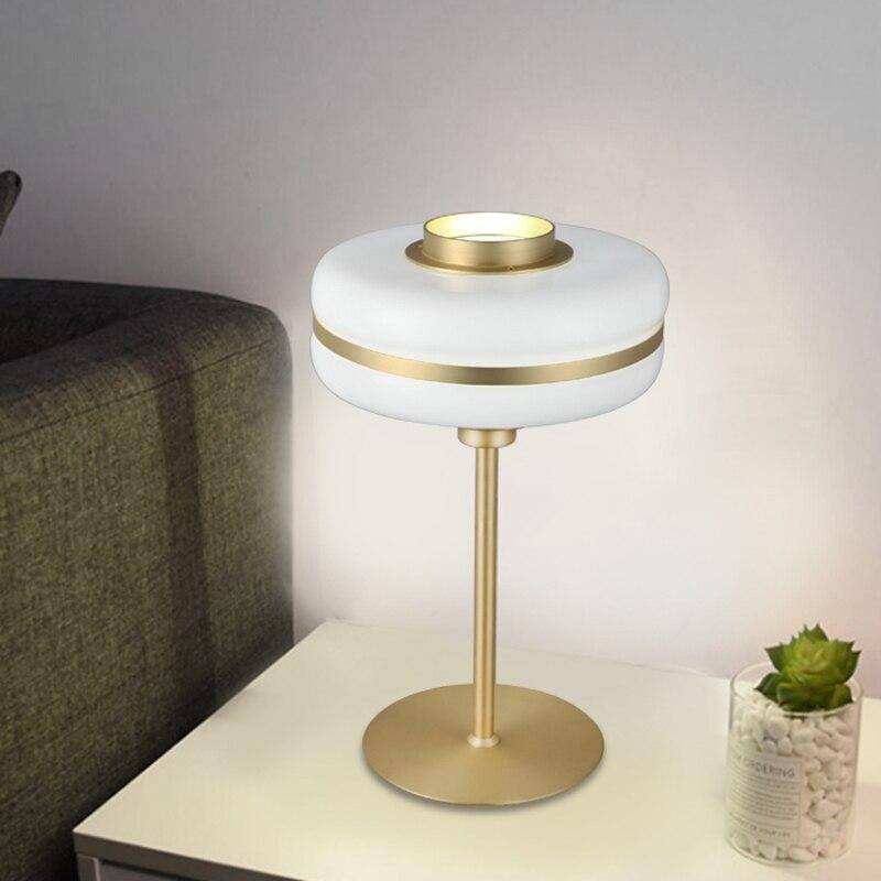 Modern LED bedside lamp with rounded shape and gold base Hotel