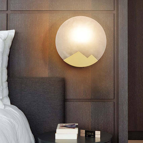 Lámpara de pared design LED con disco de mármol y metal dorado