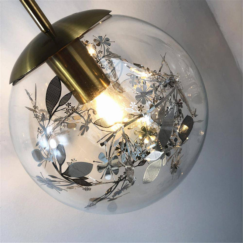 Lámpara de pared design bola de cristal llena de hojas doradas colgando