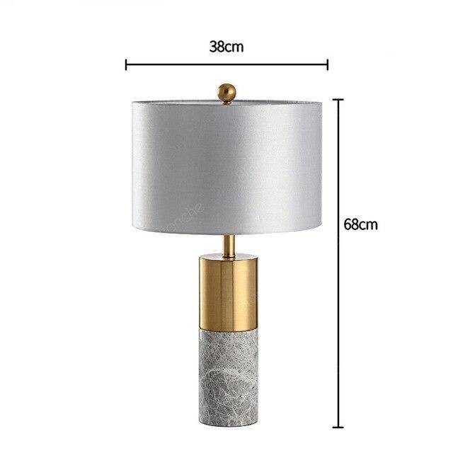 Lámpara de mesa design LED en forma de cilindro dorado y mármol