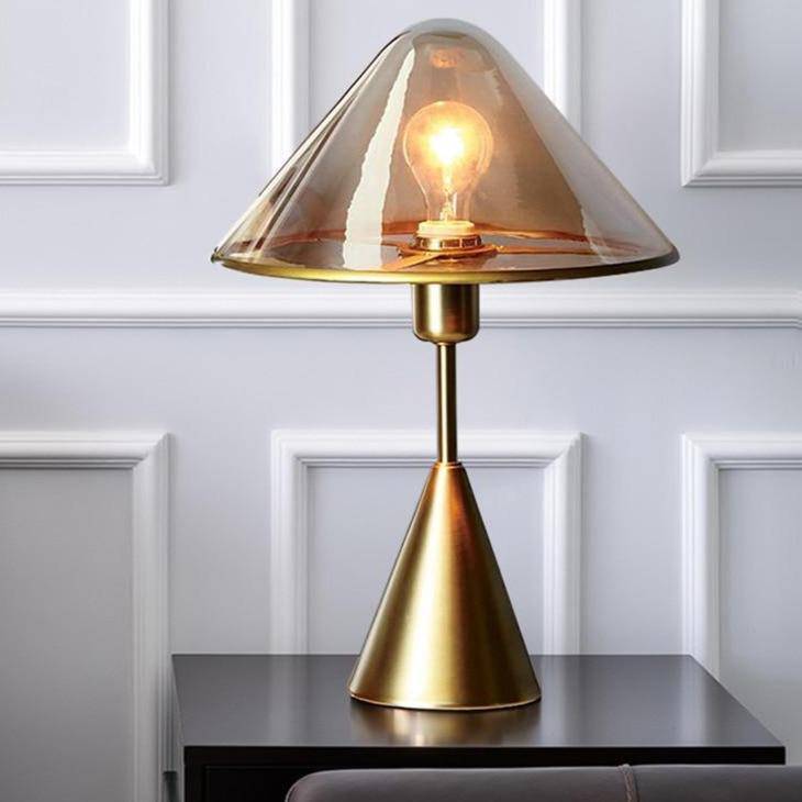 LED design table lamp with conical base in gold metal