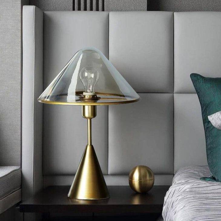 LED design table lamp with conical base in gold metal