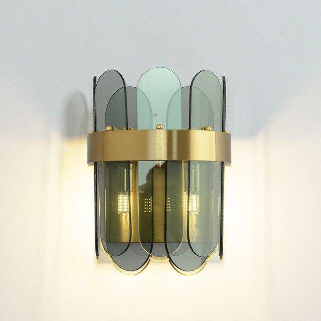 Lámpara de pared design de metal dorado y cristal de color