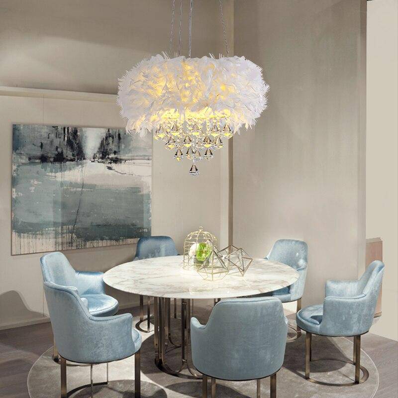 Round modern LED chandelier with feathers and crystal glass