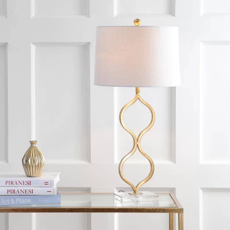 LED design table lamp with curved gold stem and lampshade