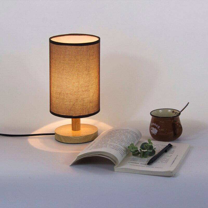 Bedside lamp with lampshade in cylindrical fabric