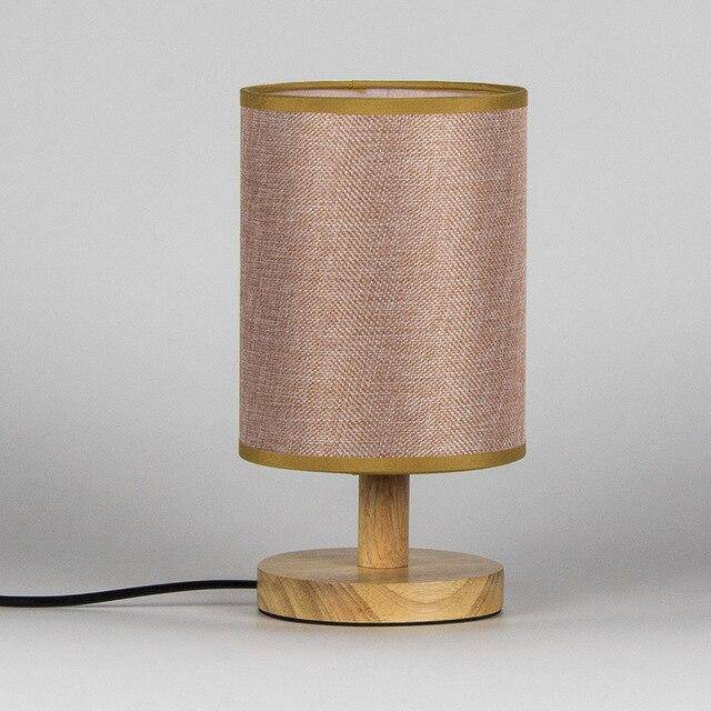 Bedside lamp with lampshade in cylindrical fabric