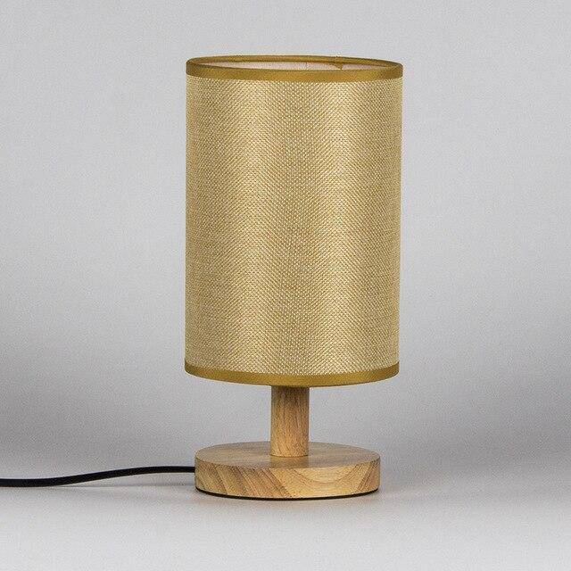 Bedside lamp with lampshade in cylindrical fabric