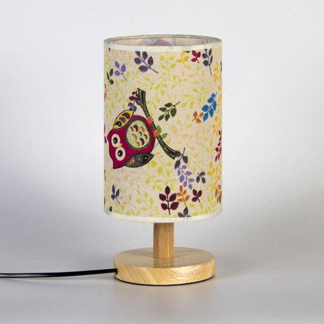 Bedside lamp with lampshade in cylindrical fabric