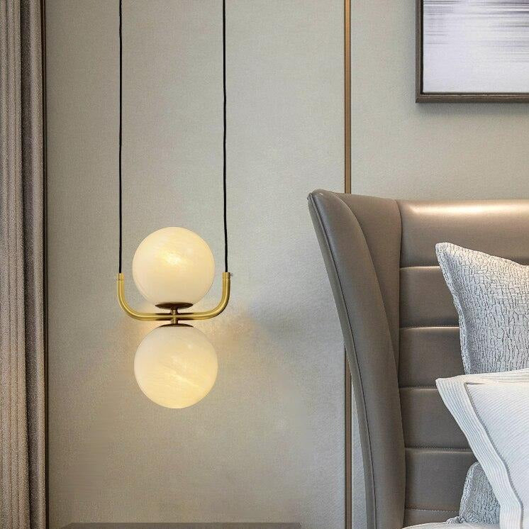 Suspension moderne avec globe en verre et tuyau doré Katneep