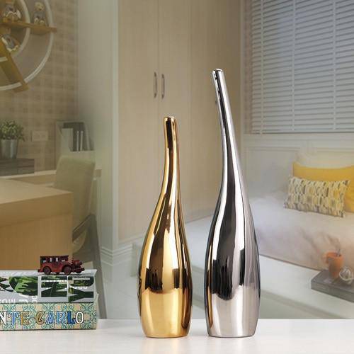 Design vase in gold and silver ceramic, minimalist style