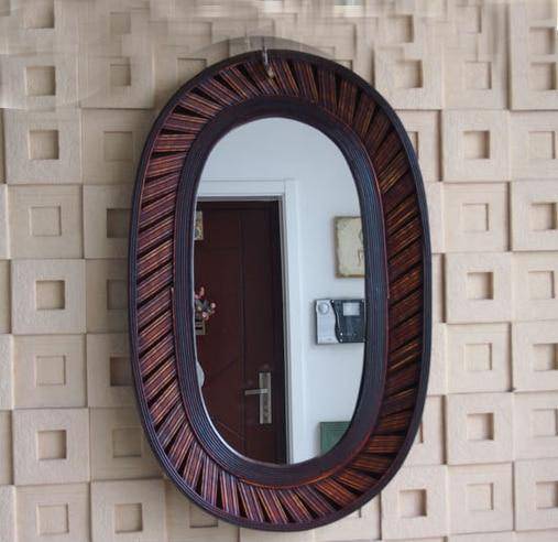 Espejo de pared decorativo largo y ovalado de bambú marrón oscuro