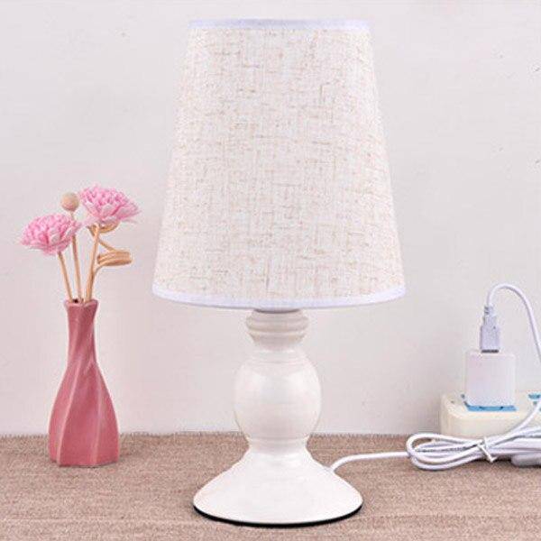 White bedside lamp with lampshade fabric with butterfly and flowers