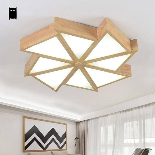 Wooden LED ceiling fixture in the shape of several triangles