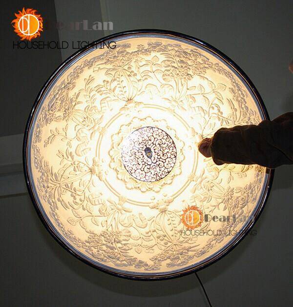 pendant light half sphere design with floral engraving inside