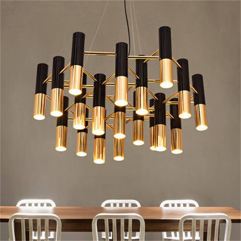 Design chandelier with black and gold metal tubes Italy