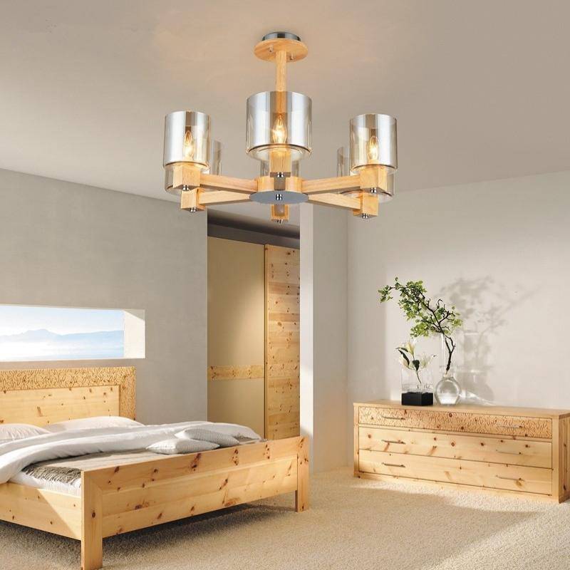 Design chandelier in wood and lampshade in glass