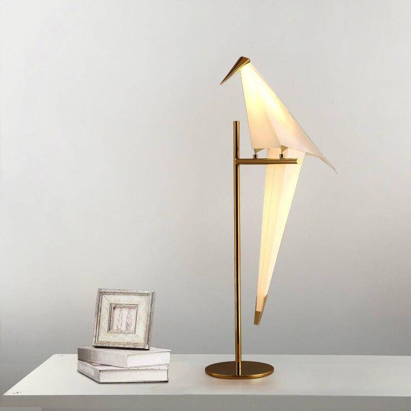Table lamp in the shape of a bird on a golden branch