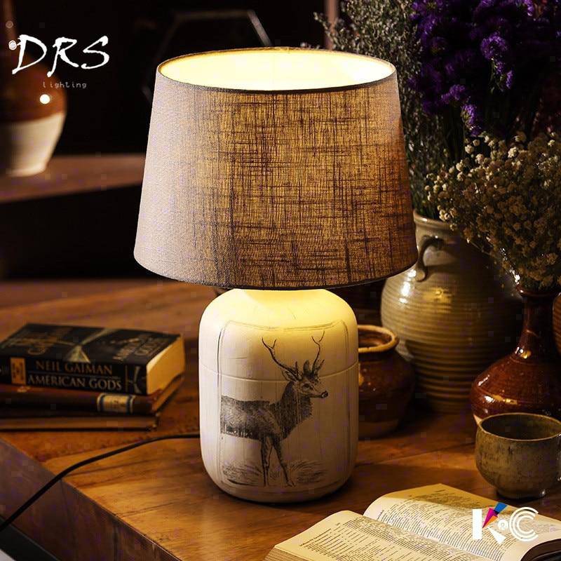 Bedside lamp with lampshade fabric and deer design