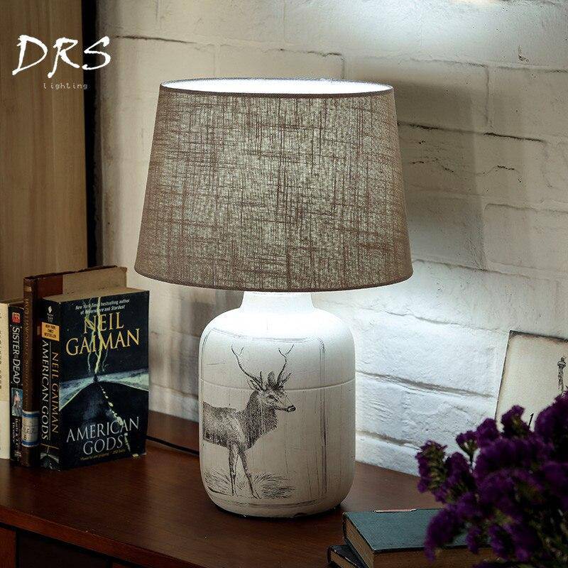 Bedside lamp with lampshade fabric and deer design