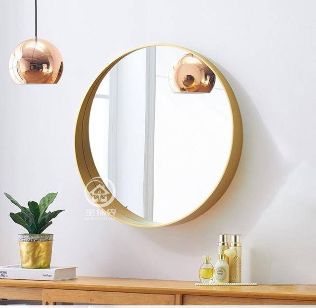 Round wall mirror with coloured metal edge