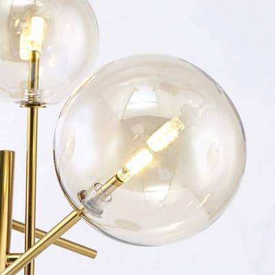 Lámpara de pie design LED dorada con ramas y bolas de cristal Girada