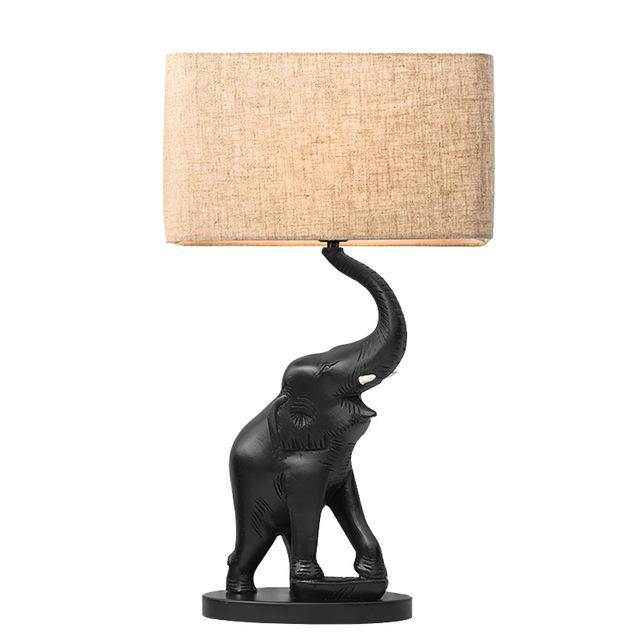 Bedside lamp in the shape of an elephant in resin and lampshade