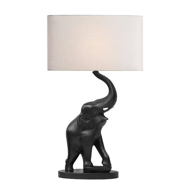 Bedside lamp in the shape of an elephant in resin and lampshade