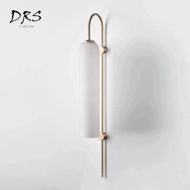wall lamp glass tube and gold base Room