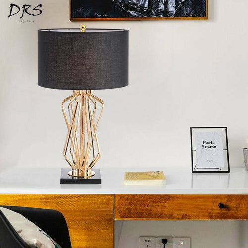 Bedside lamp with gold design stand and lampshade in fabric