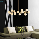 lustre design en métal doré et lampes en boules