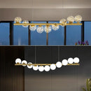 lustre nordique longue boule de verre or pour bar