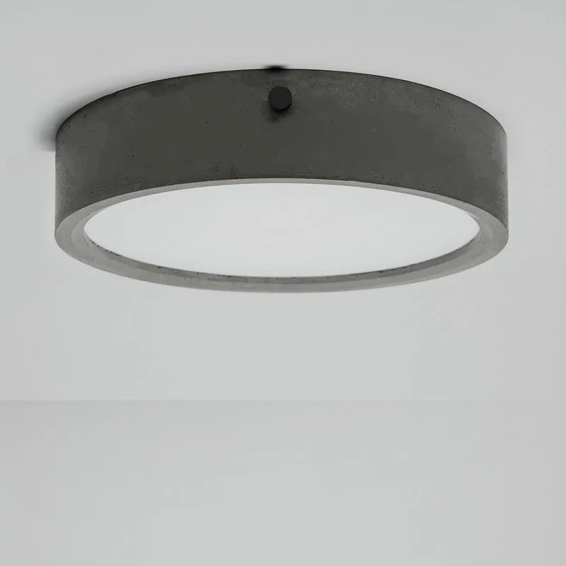 plafonnier rond en ciment style industriel pour tous espaces