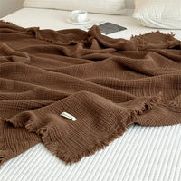 Plaid coton pompons carreaux salon chambre doux