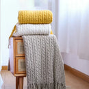 plaid bohème à carreaux avec pompons pour salon