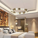 lustre led boule acrylique avec anneau doré et fils réglables