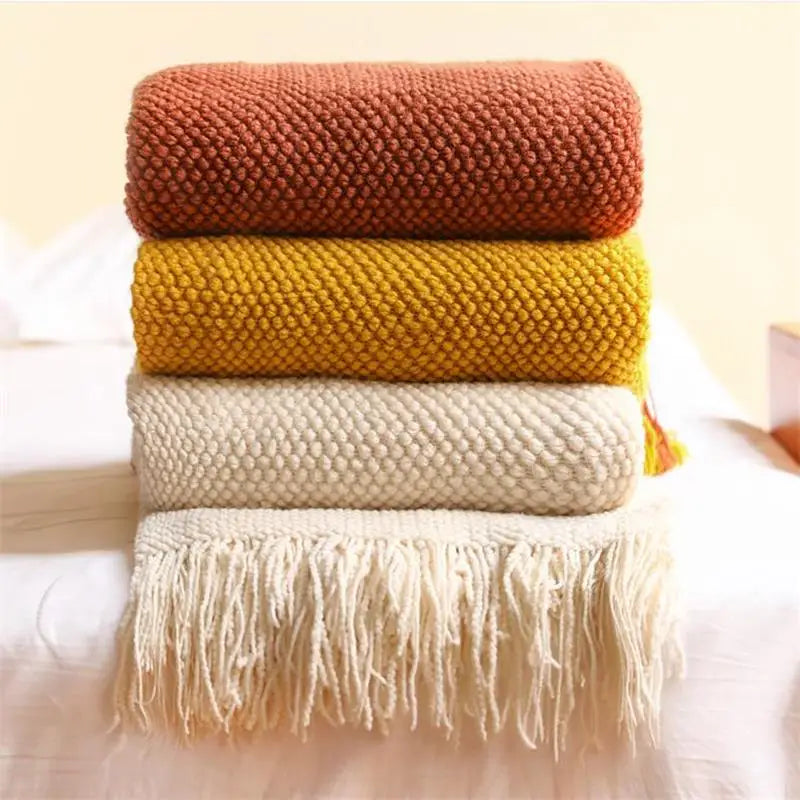 Plaid tricoté nordique à carreaux avec pompons doux